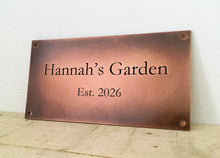 Custom copper sign with rustic antiqued finish.