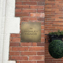 Vintage brass house sign with custom engraved logo and text