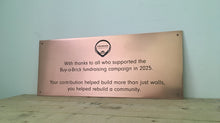 Copper dedication plaque with custom logo and branding.