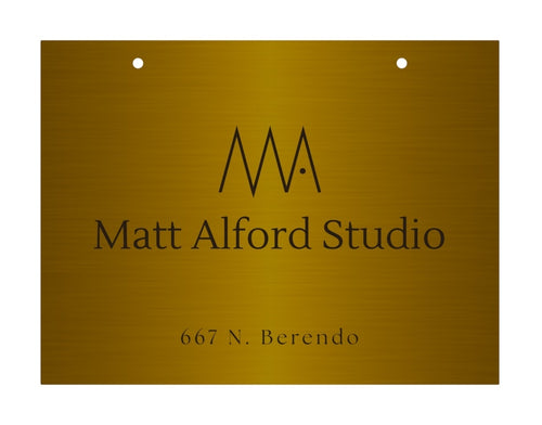 Mock-up of double-sided blade signage with custom logo, made in solid brass.